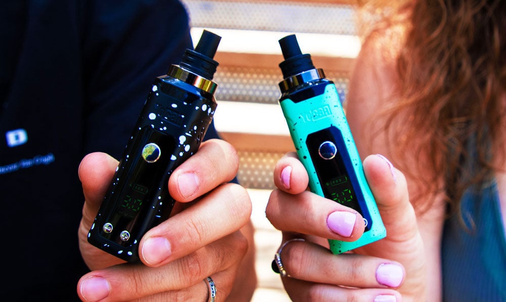 Two people holding Wulf Mods Nestor