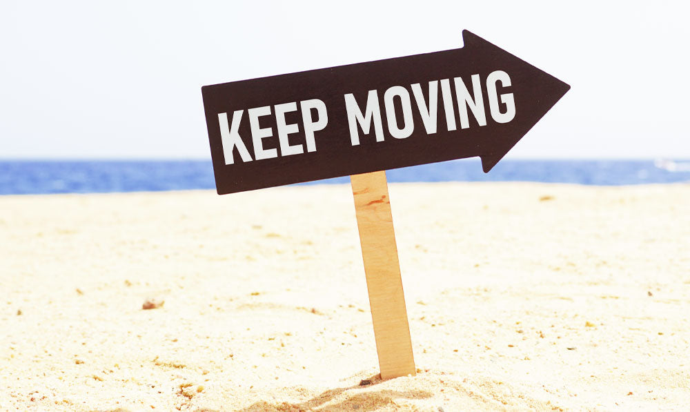 Keep Moving Sign At Beach