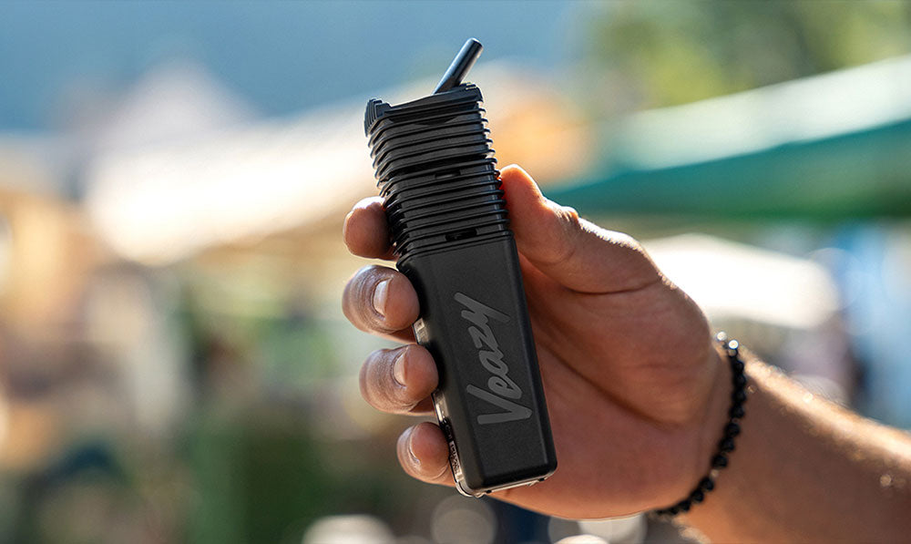 hand holding the Storz & Bickel Veazy vaporizer outside