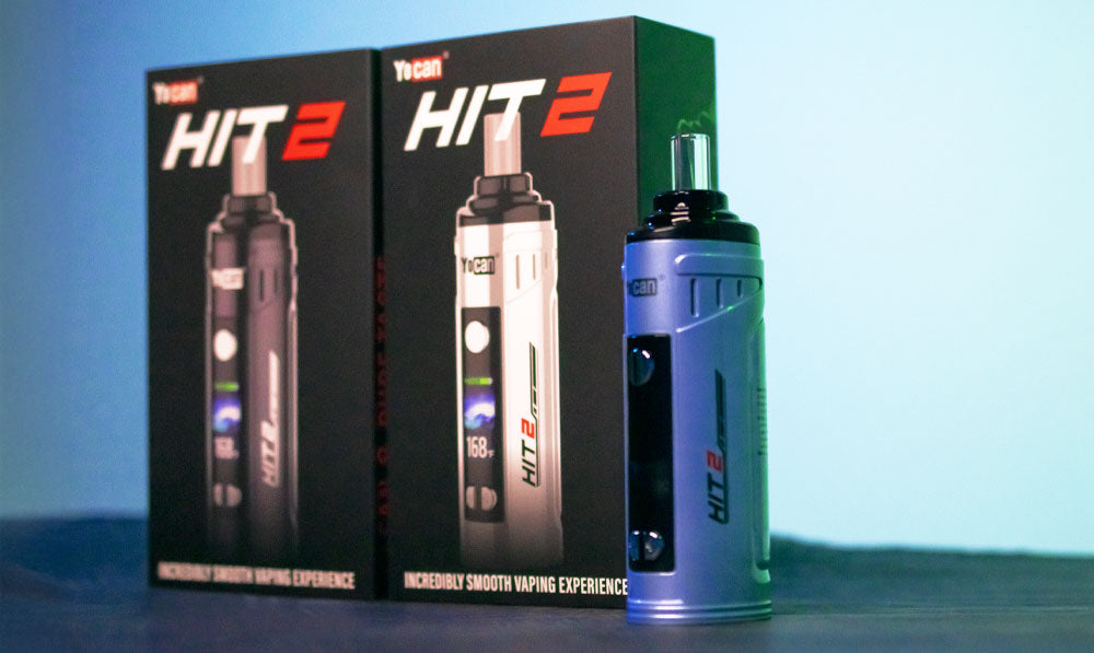 Yocan HIT 2 on dark display platform with blue studio lighting