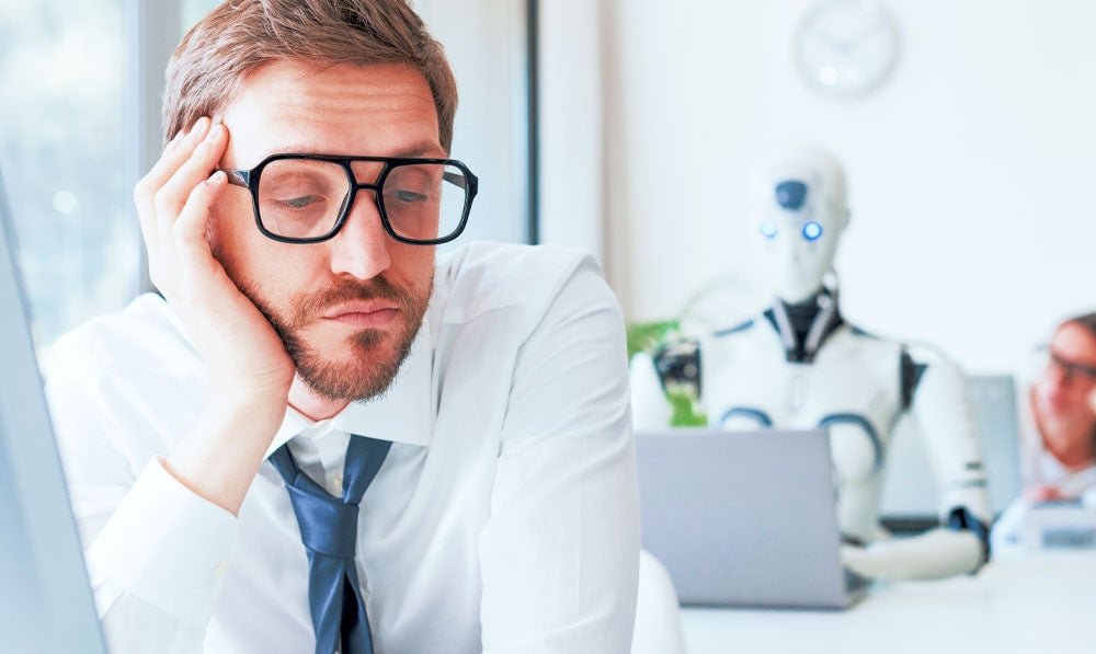 Bored Businessman With Robot Working Behind Him