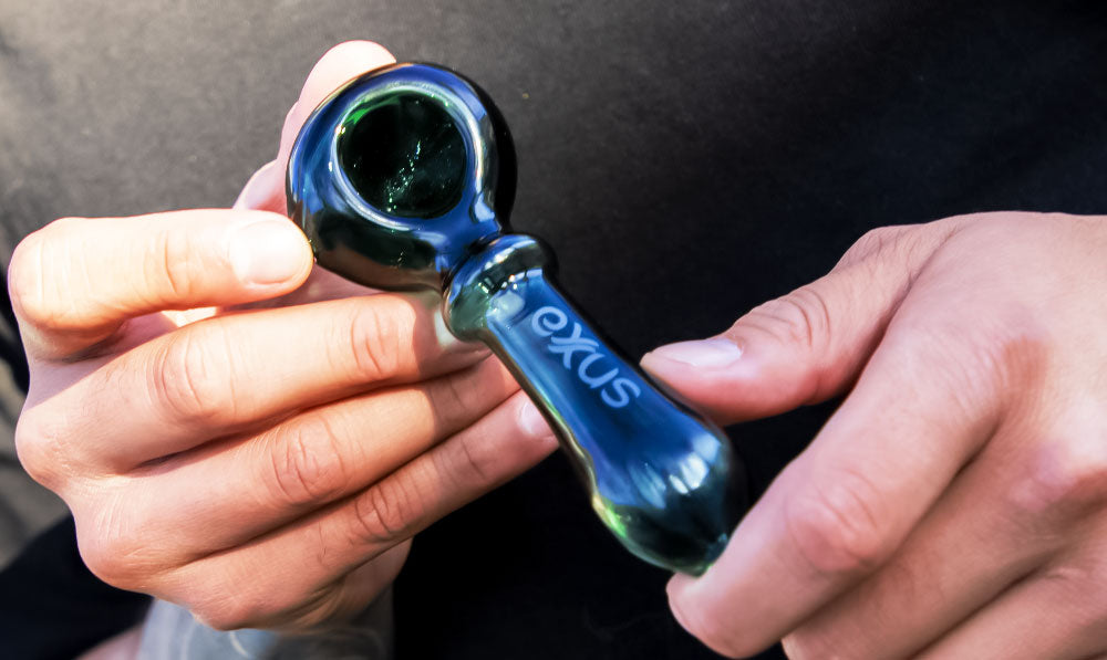 Closeup Of Man Holding Exxus Wand