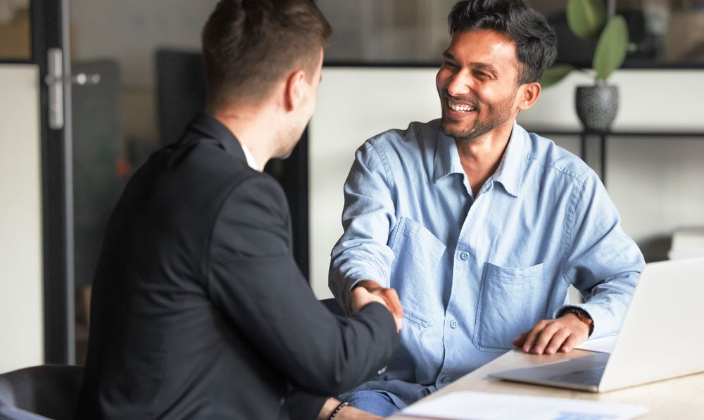 Businessman shaking hands with customer