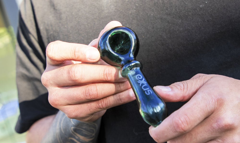Closeup of man holding Exxus Wand