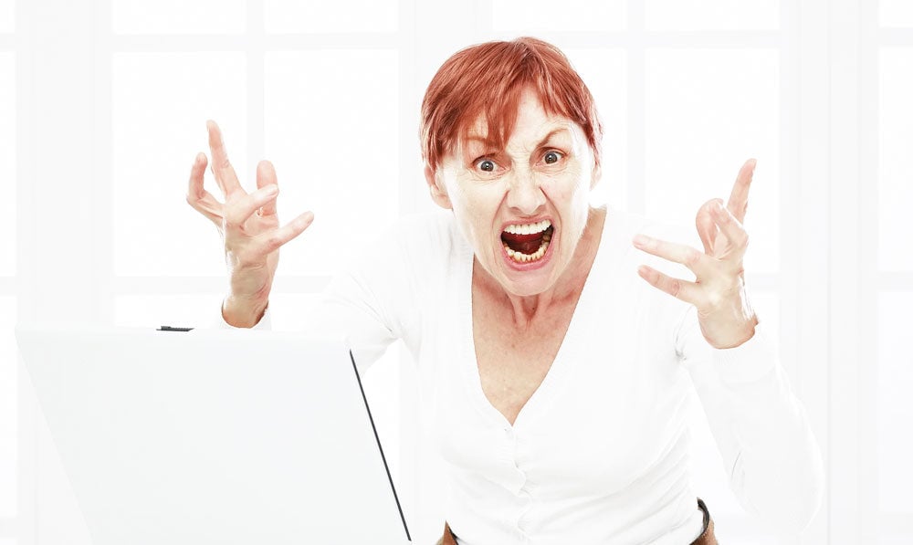 Employee With Computer And Bad Attitude