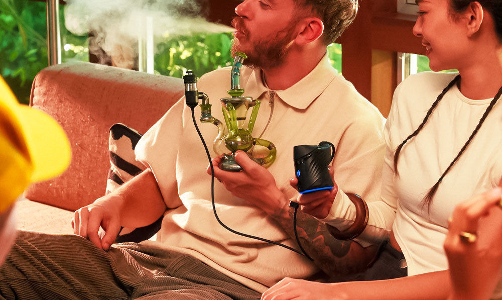 Group of people using Puffco Peak Pro Link on a couch