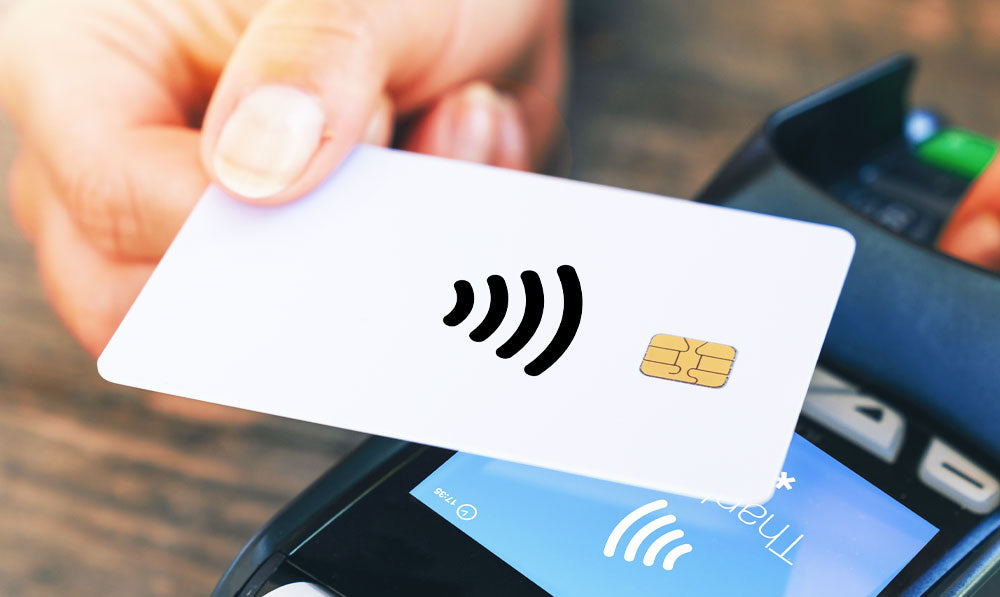 Hand Holding Card Over Processor