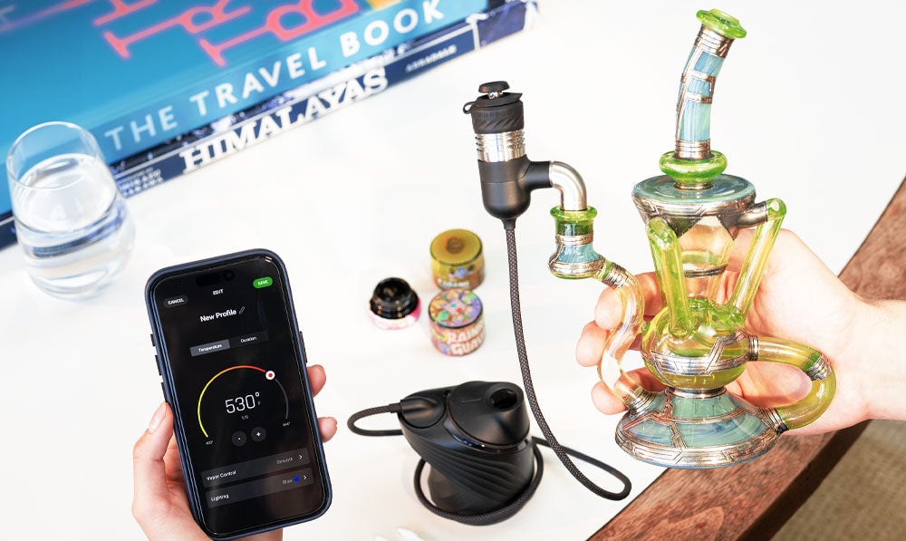 Hands Holding Puffco Link With App Open