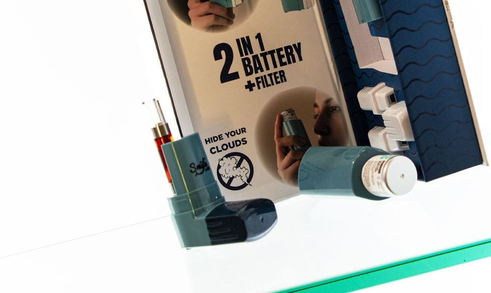 Smyle Inhaler on reflective glass surface