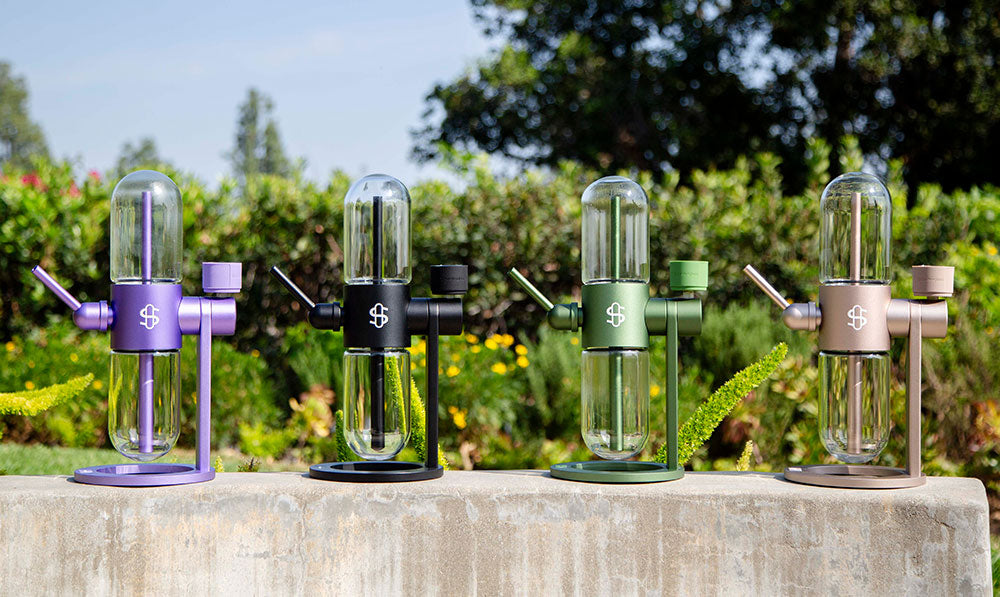 stundenglass gravity infusers tanding in backyard