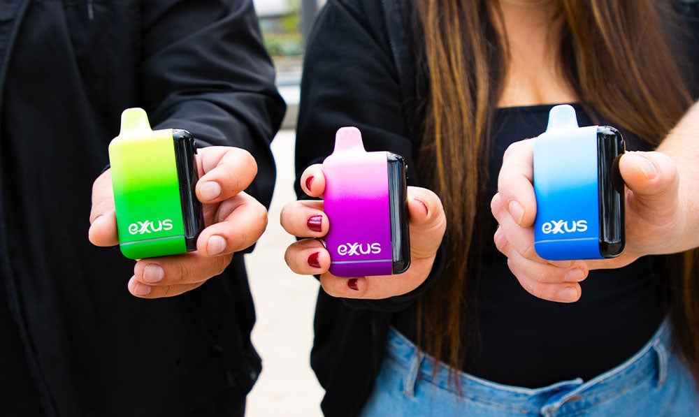 friends holding Exxus Snap DLX at park