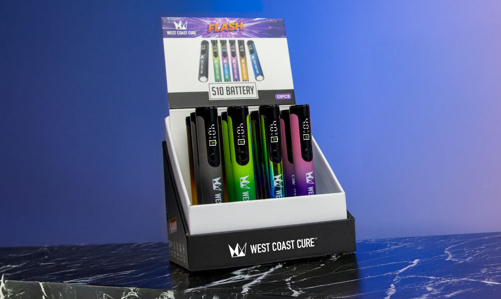 West Coast Cure Flash 12pk standing on marble table with colorful background