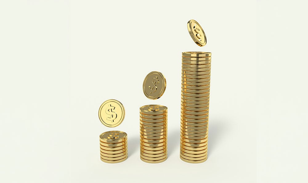 gold coins on floor with beige background
