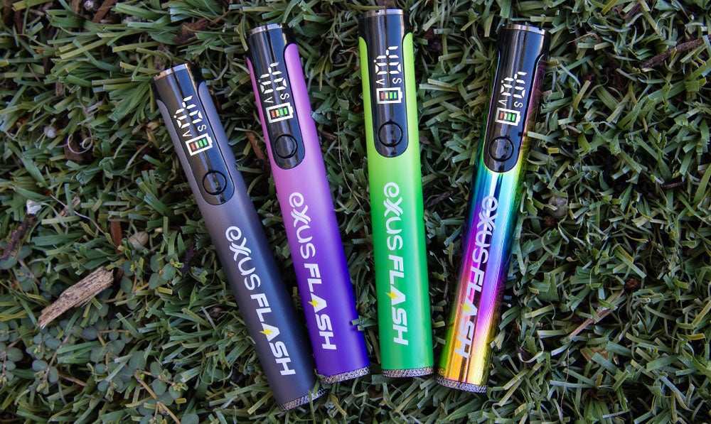 Exxus Vape Flash Flashlight and 510 Variable Voltage Battery all colors on grassy background