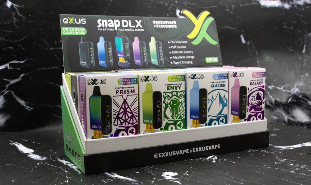 Exxus Vape Snap DLX 510 Voltage Battery 12pk on marble black pattern background