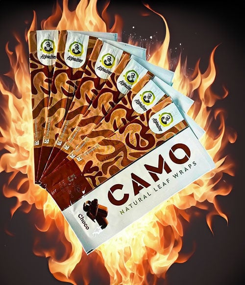 Afghan Hemp wraps on fire over a dark background