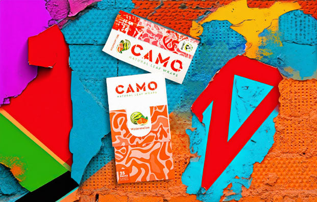 Camo Wraps on Blue and Orange wall with Graffiti