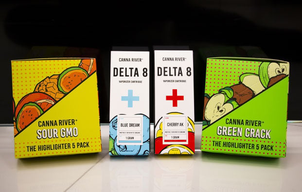 Canna River products on display in front of black wall