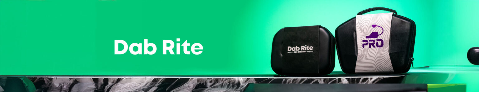 Dab Rite Products resting on black marble display in front of green studio background