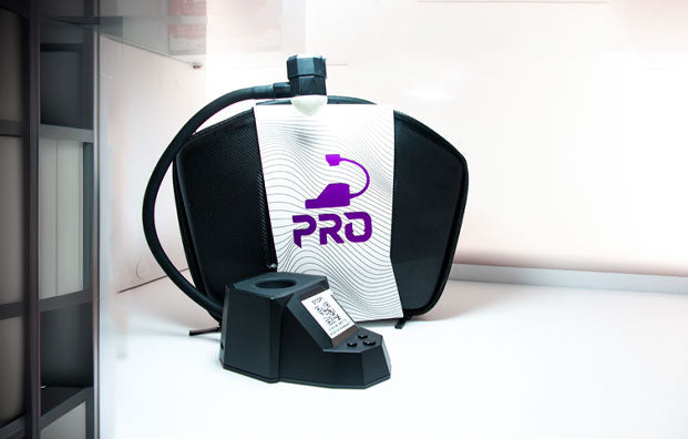 Dab Rite Pro standing on white display with window nearby