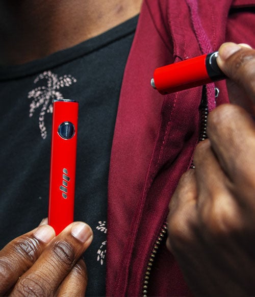Dip Devices apart in man's hand