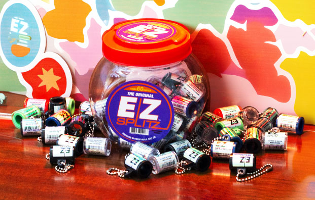 EZ Splitz products on wooden display with colorful wall art