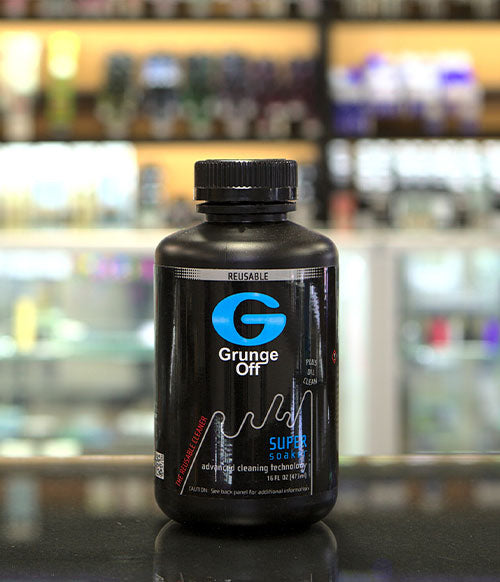 Grunge Off bottle sitting on table at smoke shop