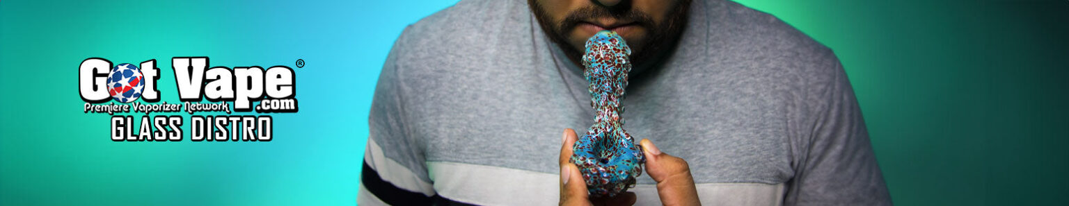 man holding unique hand pipe with Got Vape Glass Distro logo