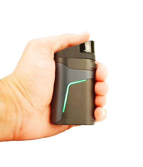 Hand holding Dr. Dabber Ghost 2 in front of white background