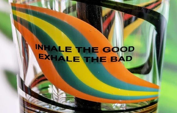 Closeup of iDab glass with message