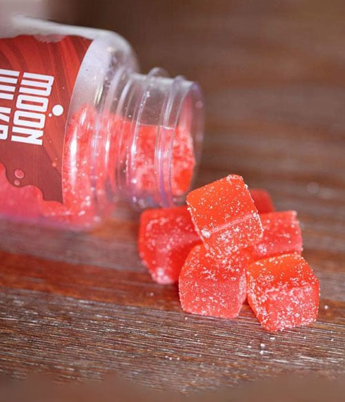 Moonwlkr Gummies resting on wooden desk