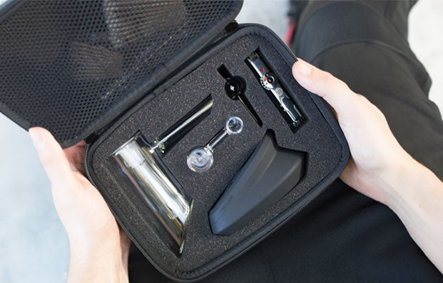 man holding the Myster Hamr rig kit packaging