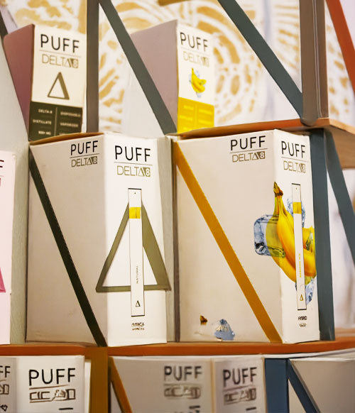 Puff Delta 8 standing on decorative shelves