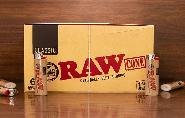 RAW Cones with BIC lighters on wooden table
