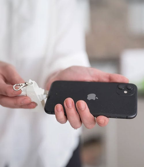 man connecting Sealz to iPhone