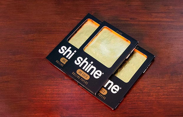 Shine rolling papers on wood table