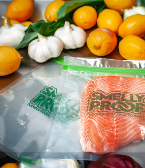 Smelly Proof Products on wooden table with food inside and around