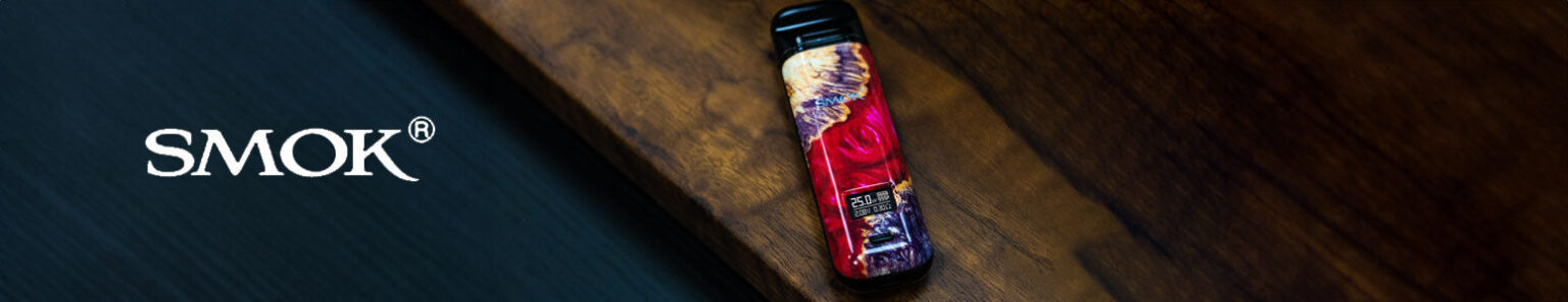 SMOK Novo 4 laying on wooden table with SMOK Logo