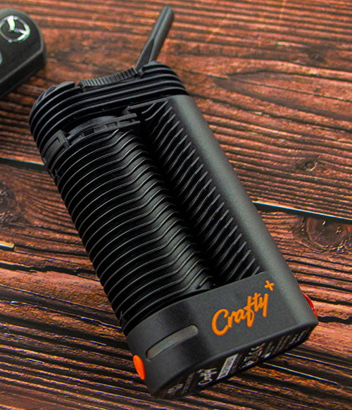 Storz & Bickel Crafty Plus laying on wooden table