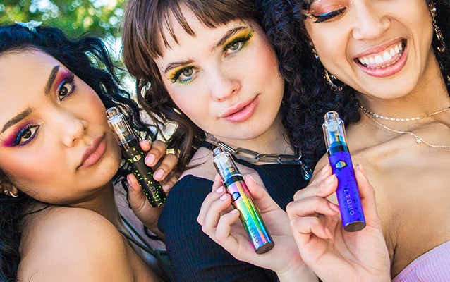 three women holding Wulf Orbits at park