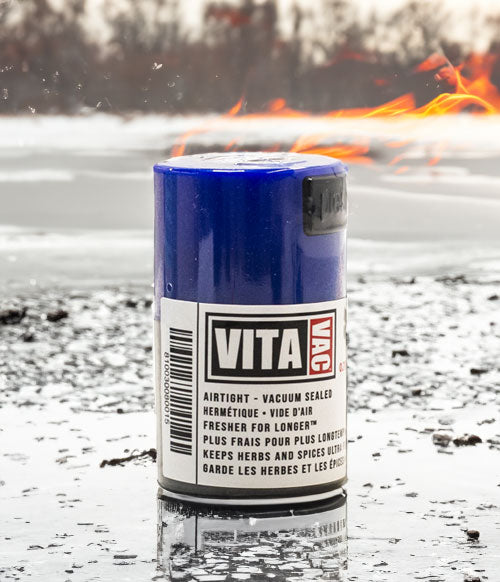 tightpac standing on ice lake with fire under extreme weather conditions