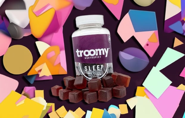 Troomy Sleep on Purple Background with Pastel Shapes