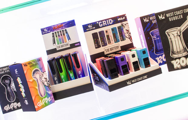 West Coast Cure Products Lined Up Glass Display
