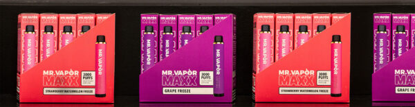 Wholesale Mr. Vapor disposable packs in a row on a black background