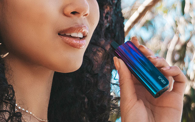 woman holding Exxus Snap VV outside