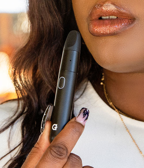 woman holding GPen Micro Plus outside at park