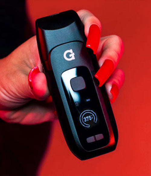 woman with nails holding G Pen Dash Plus with red background