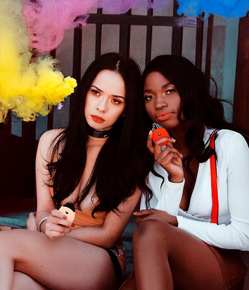 Young Women Sitting with Suorin Vapes